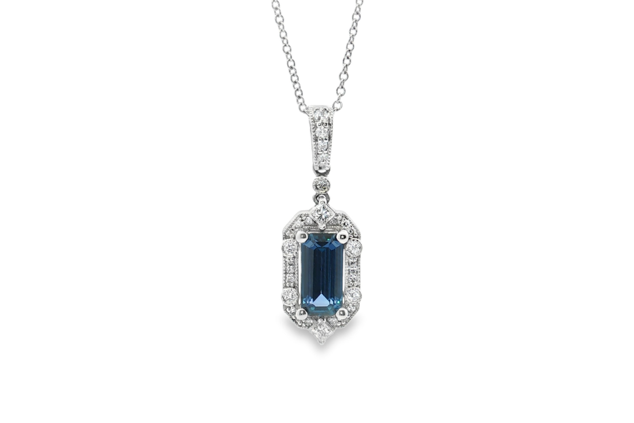A Yogo Sapphire and Diamond drop pendant necklace.