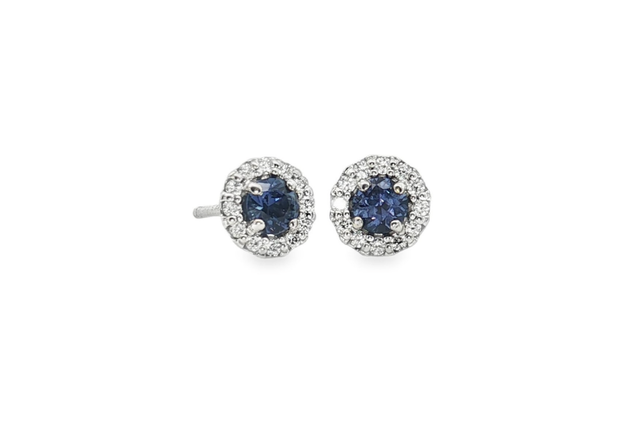 A pair of Yogo Sapphire and Diamond stud earrings.