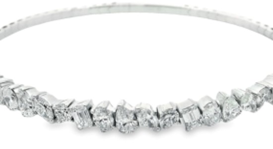 A white gold diamond tennis bracelet featuring different diamond cuts, available at Goldsmith Gallery Jewelers.