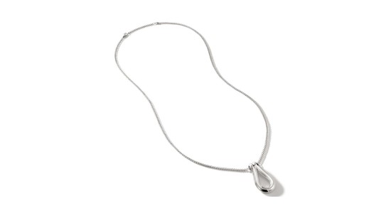 a white gold chain necklace with a sculptural pendant
