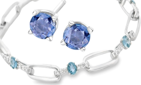 A close-up of a bracelet and pair of stud earrings featuring Yogo sapphires, both available at Goldsmith Gallery Jewelers.